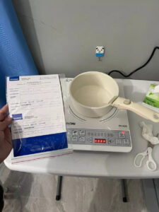 Customer image of Hyundai HI-A25 Induction Cooker, demonstrating its use on a countertop.
